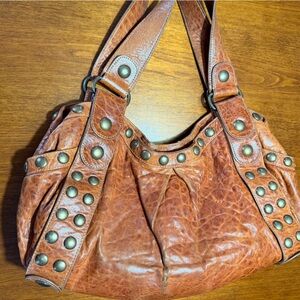 Kooba Jillian Bourbon Pebbled Leather shoulder bag.